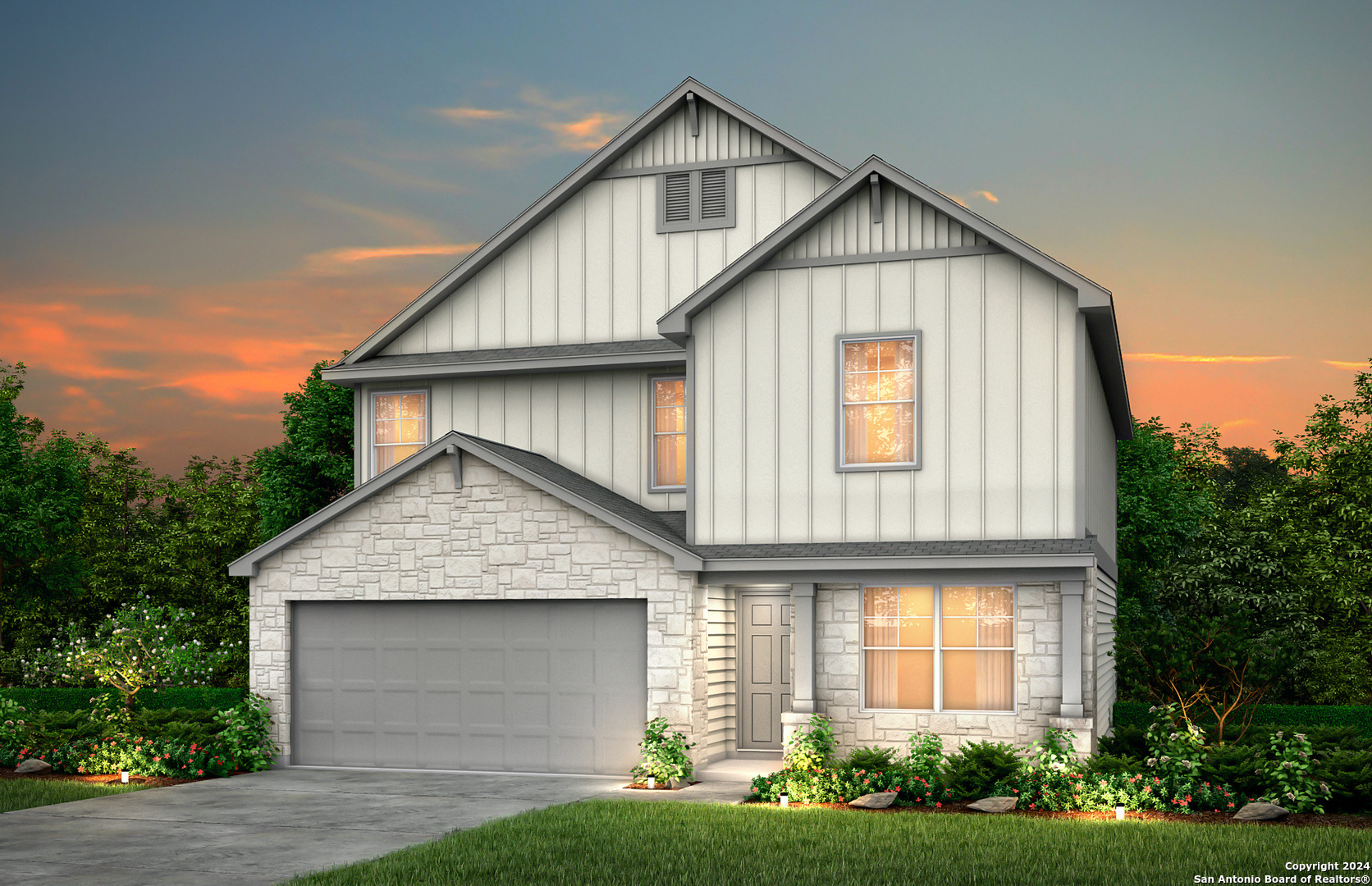 a front view of a house with a yard and garage