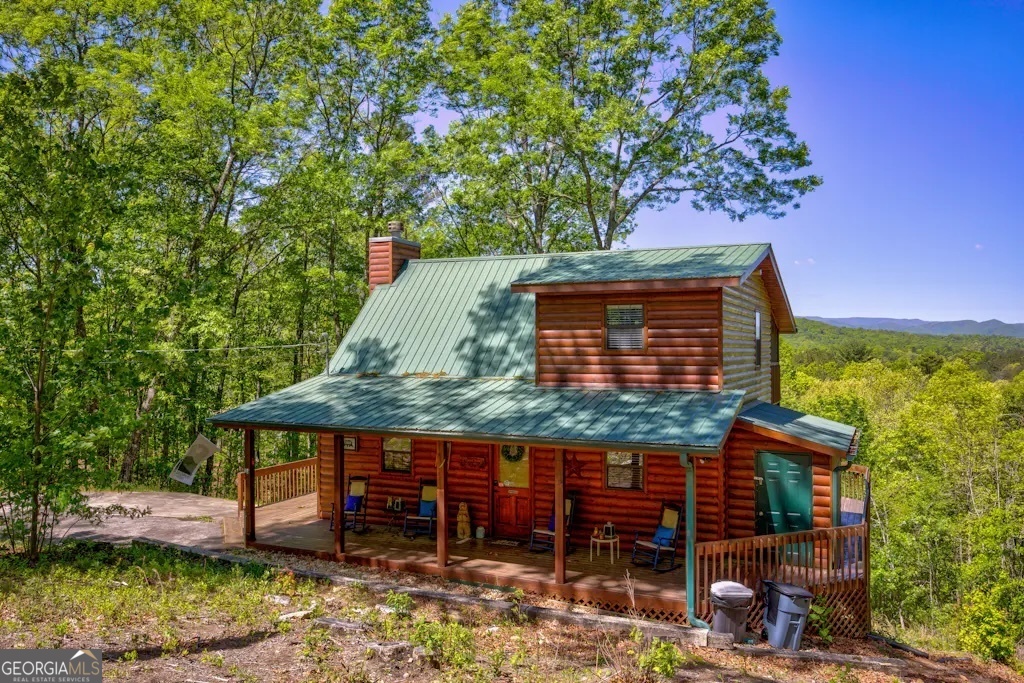 front view of a house with a tree