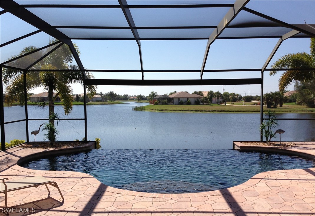 a view of swimming pool with outdoor seating