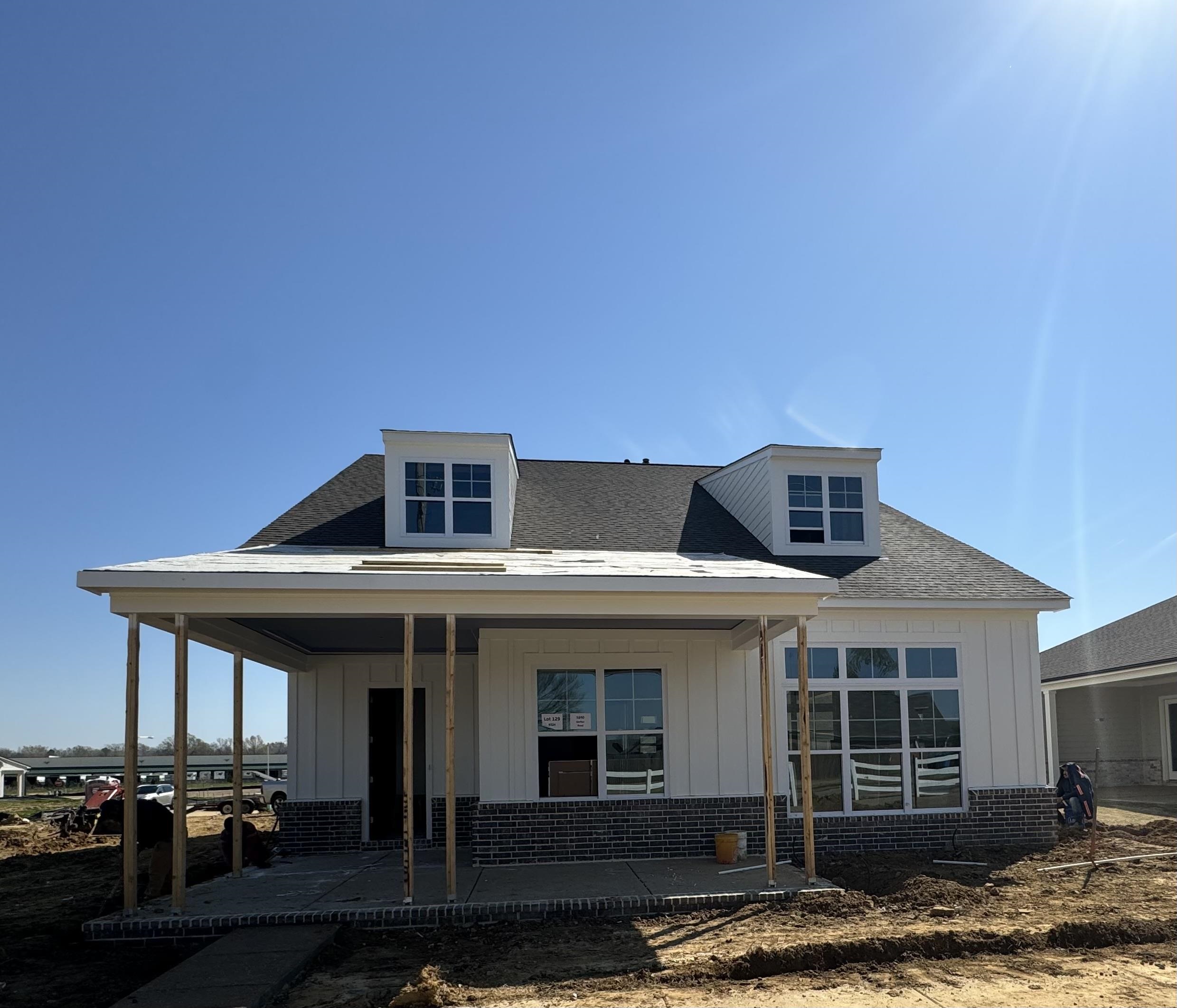 a front view of a house with a garage