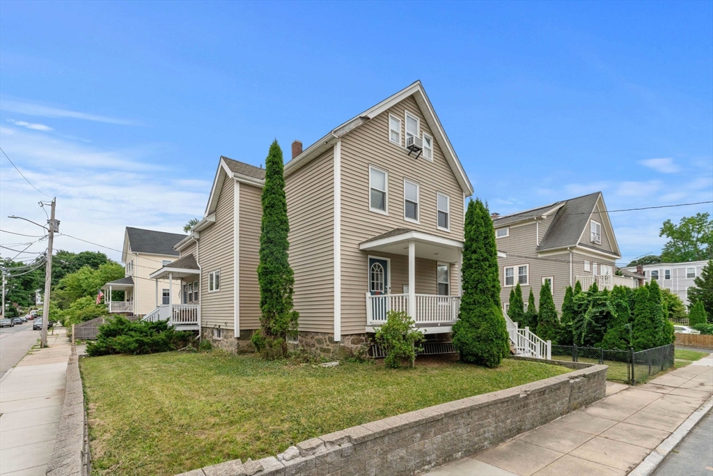 a front view of a house with a yard