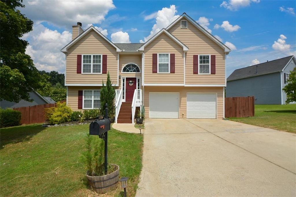 a front view of a house with a yard