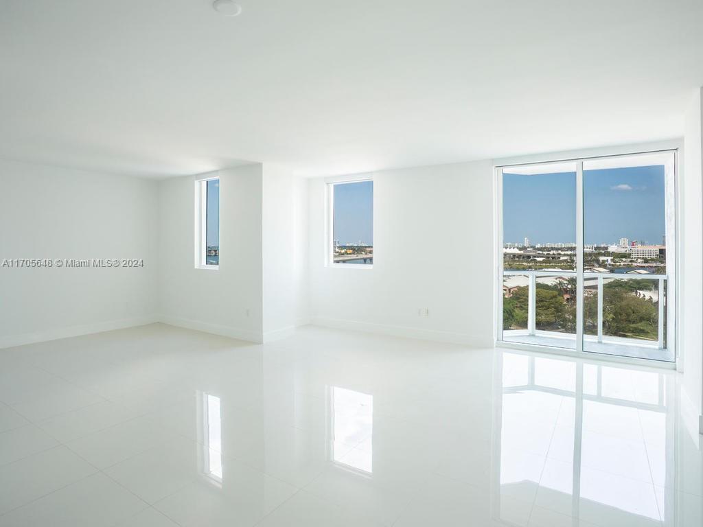 a view of empty room with windows