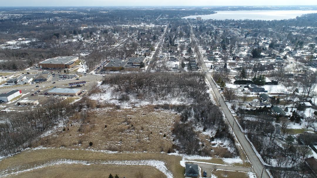 an aerial view of residential house and green space