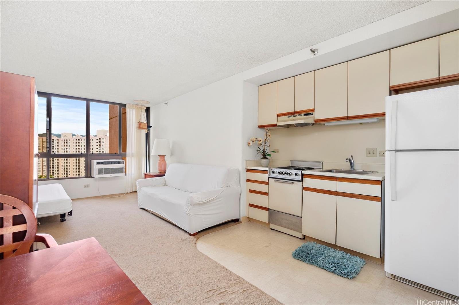 a kitchen with stainless steel appliances granite countertop a refrigerator sink and cabinets