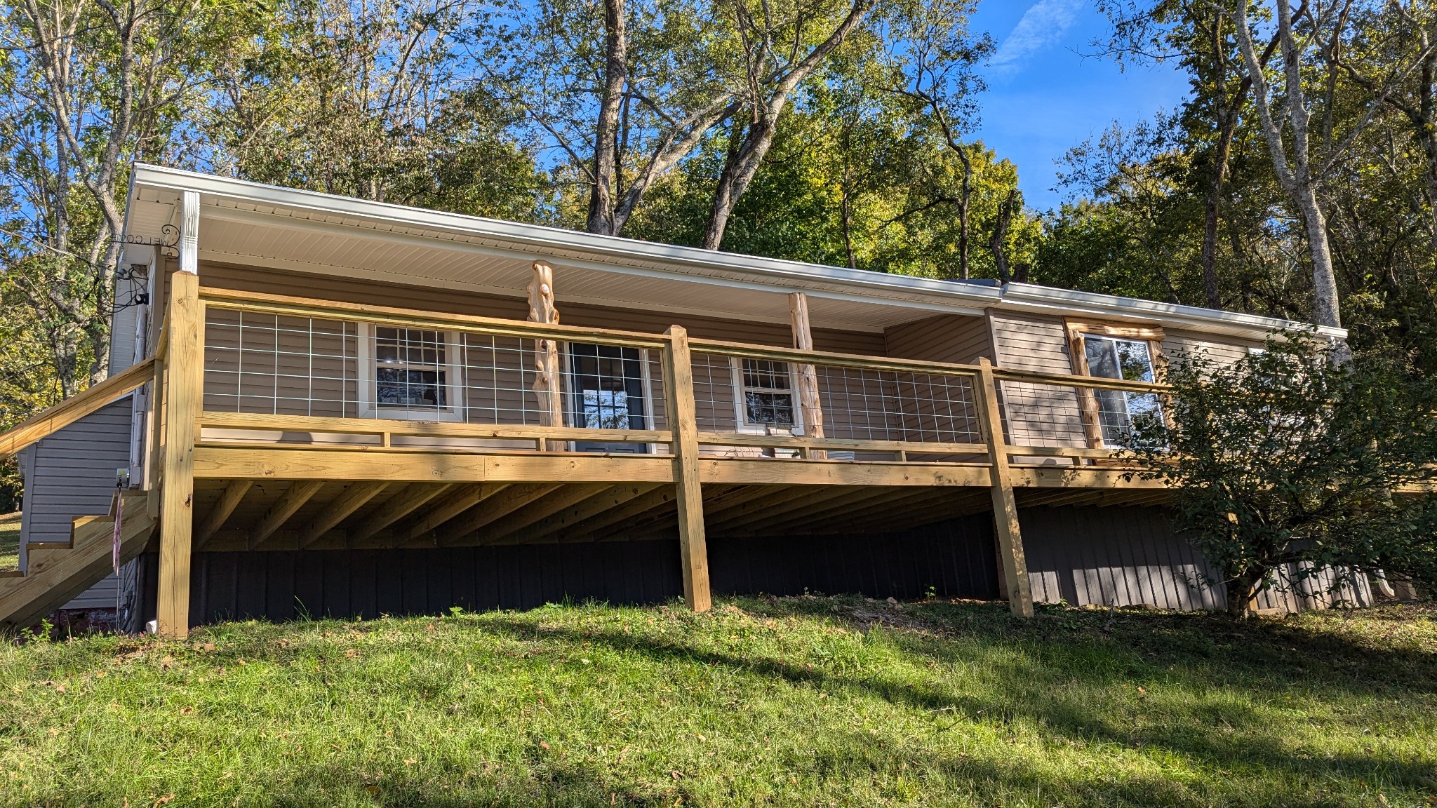 a view of house with backyard