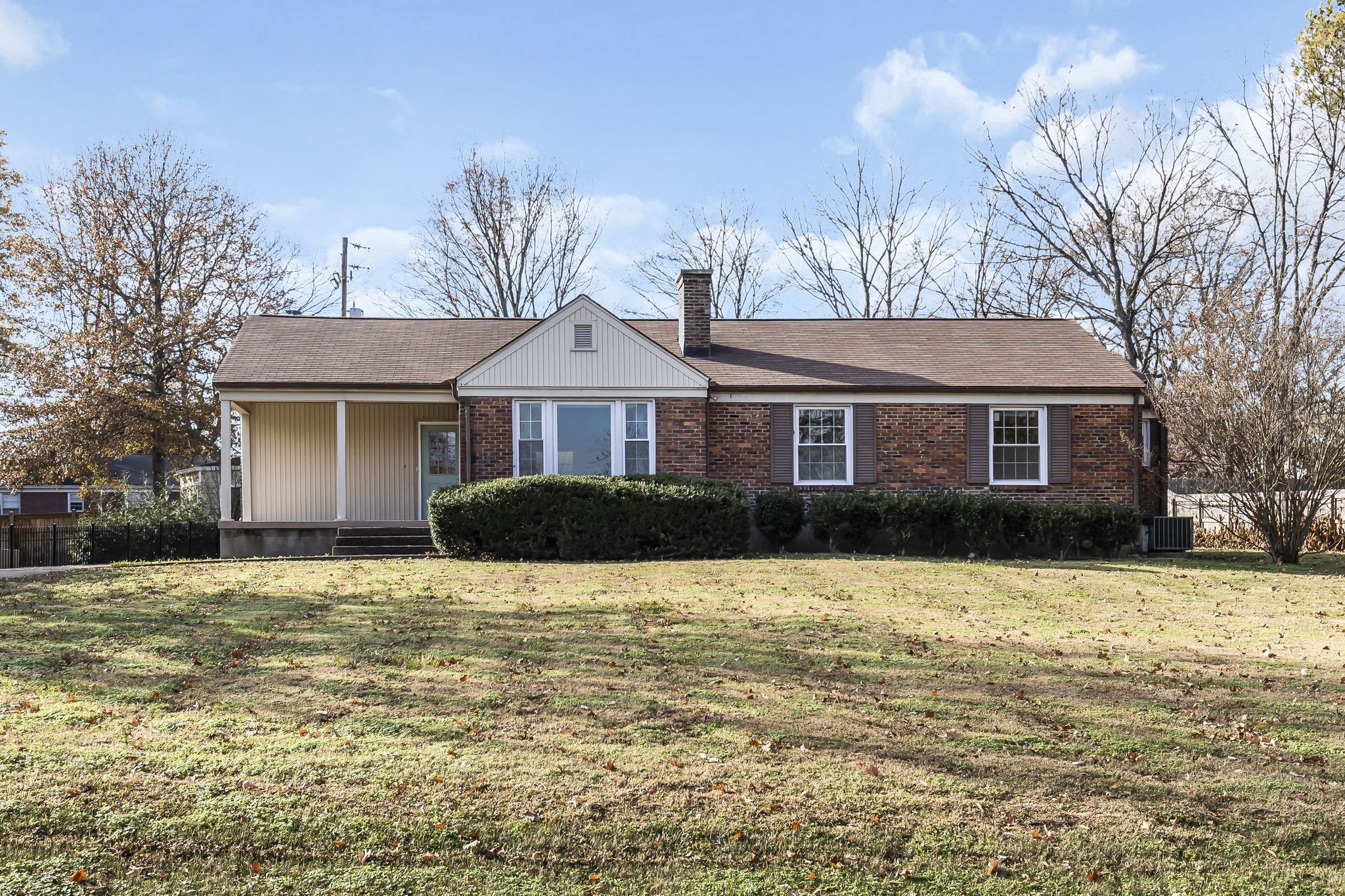 a front view of a house with yard