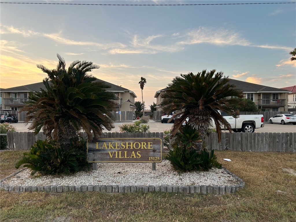 a sign that is sitting in front of a house