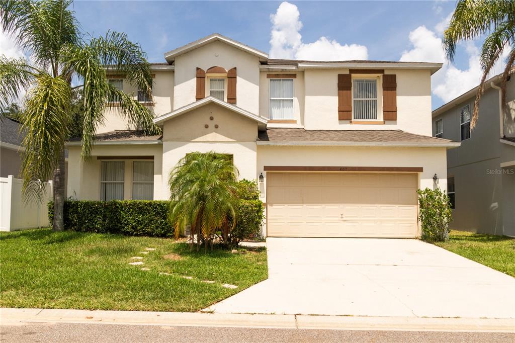 front view of a house with a yard