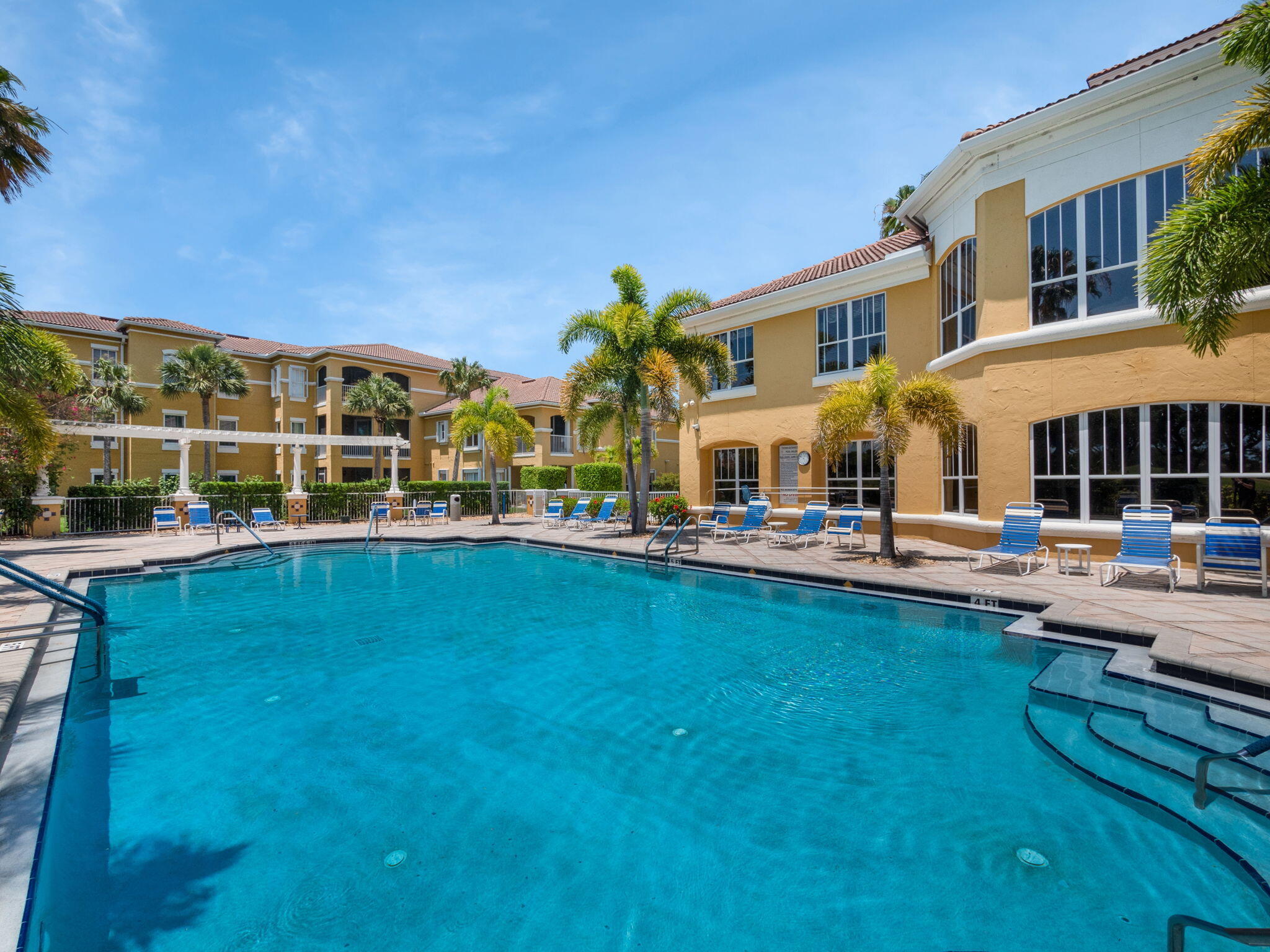 a view of a swimming pool with lounge chair