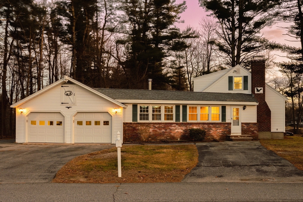 a front view of a house with garage