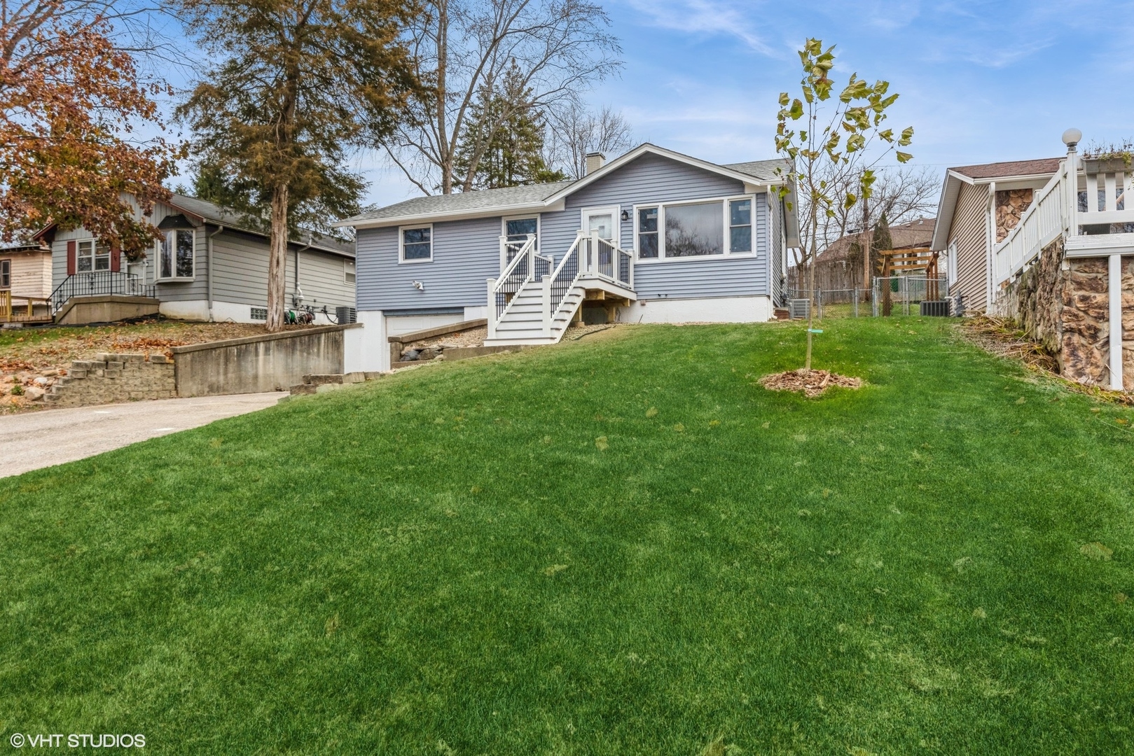 a front view of house with yard and green space