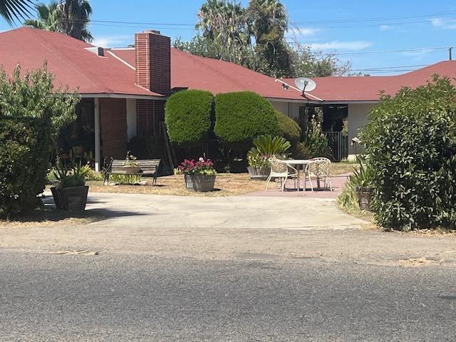 a view of building with yard and swimming pool