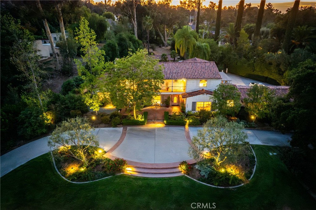 an aerial view of a house with yard swimming pool and outdoor seating