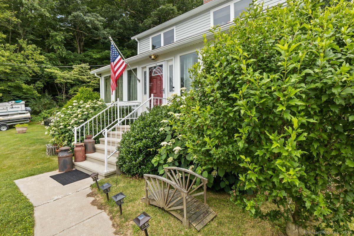 a front view of a house with garden