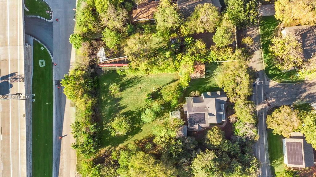 an aerial view of a residential apartment building with a yard