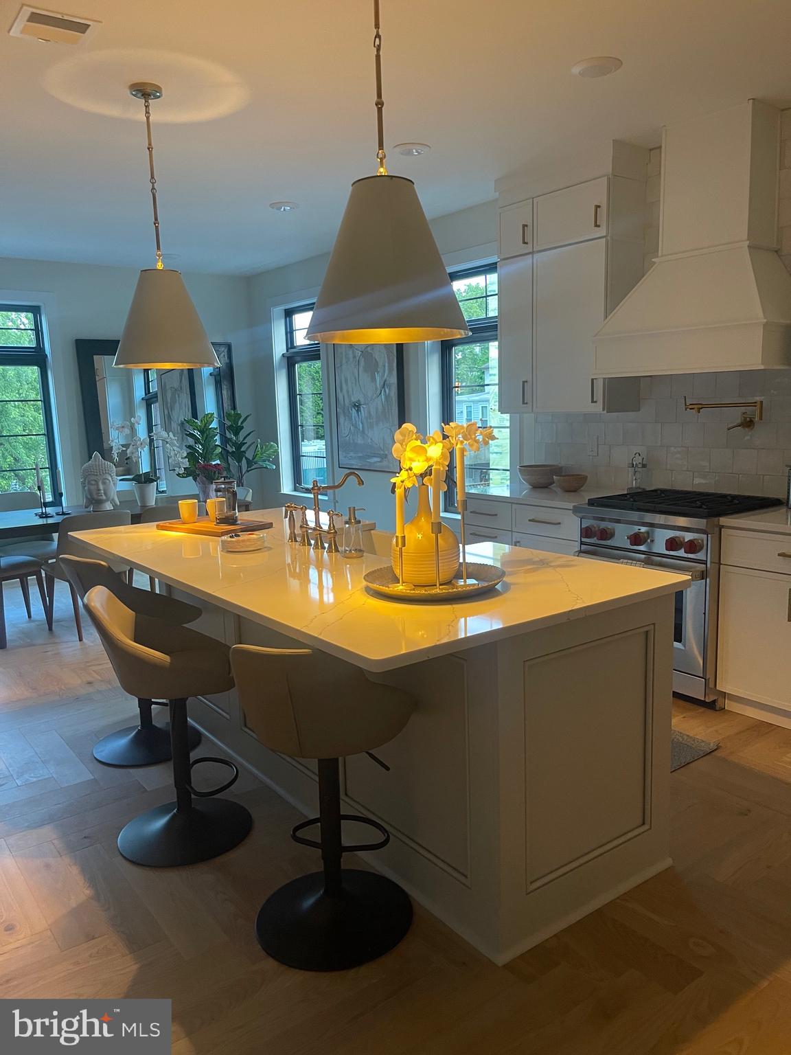 a kitchen with a sink appliances and a table