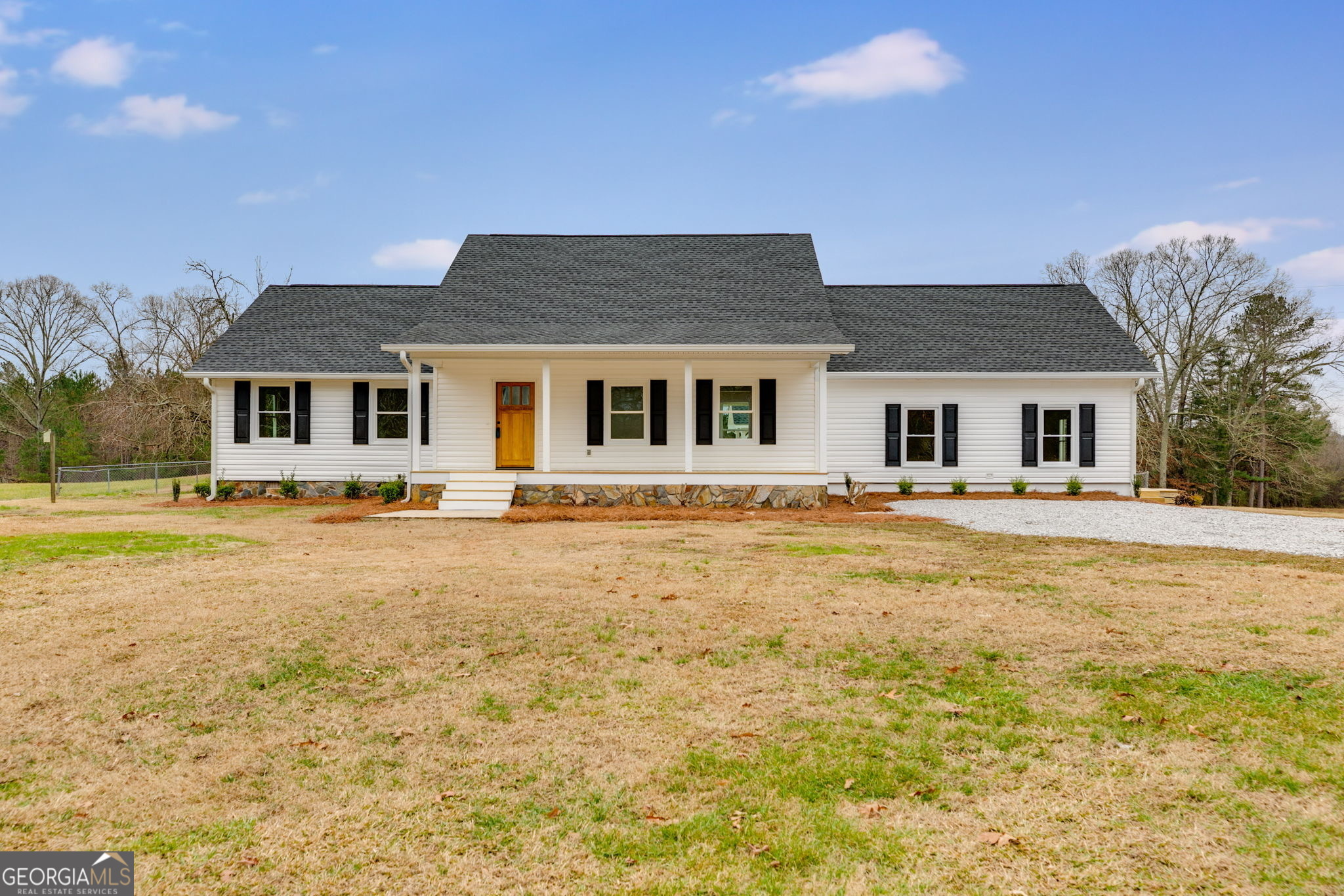 a front view of a house with a yard