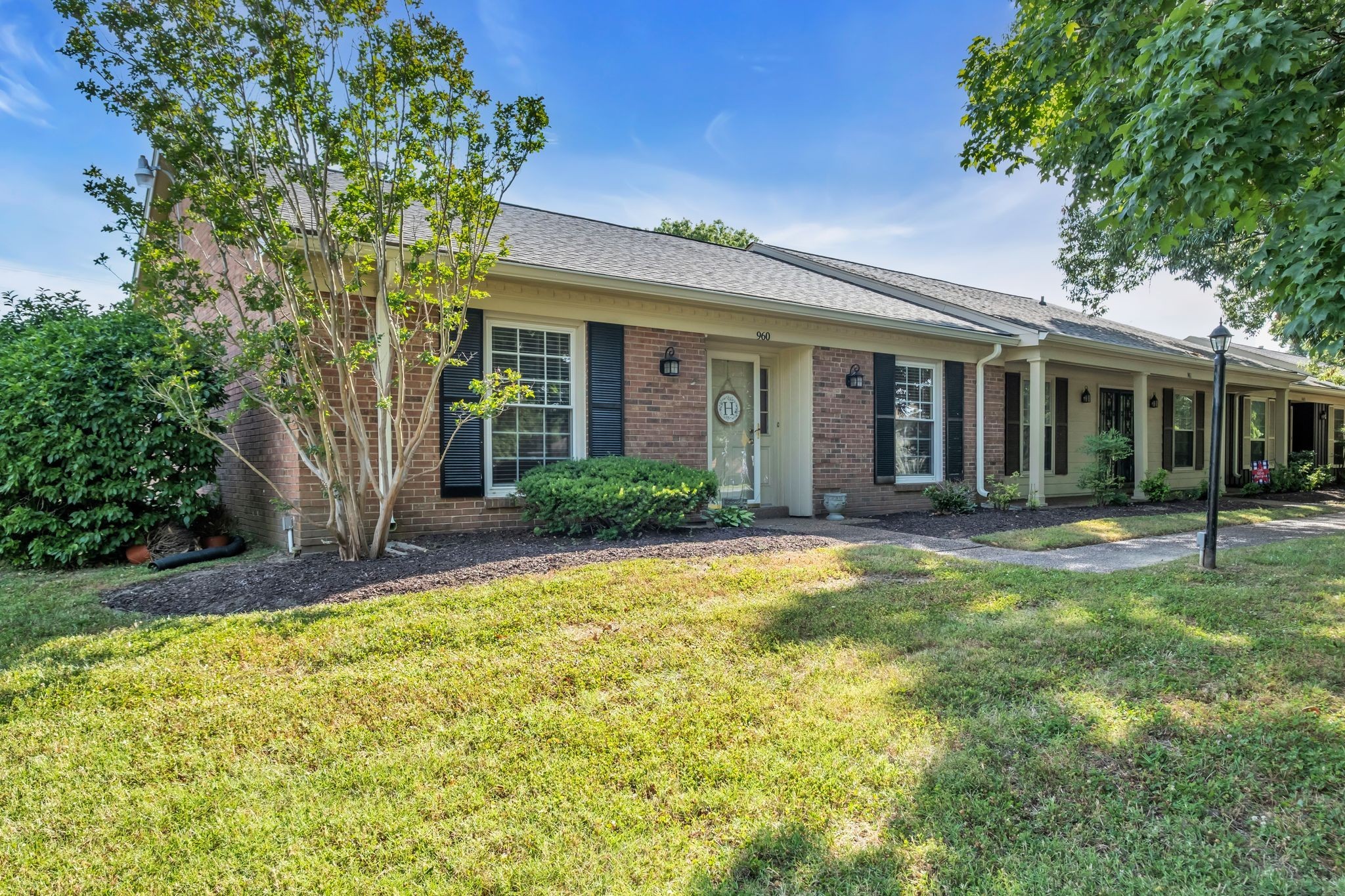 front view of a house with a yard