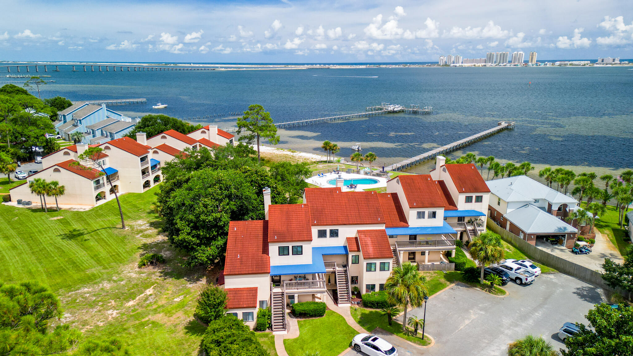 an aerial view of a house with a lake view