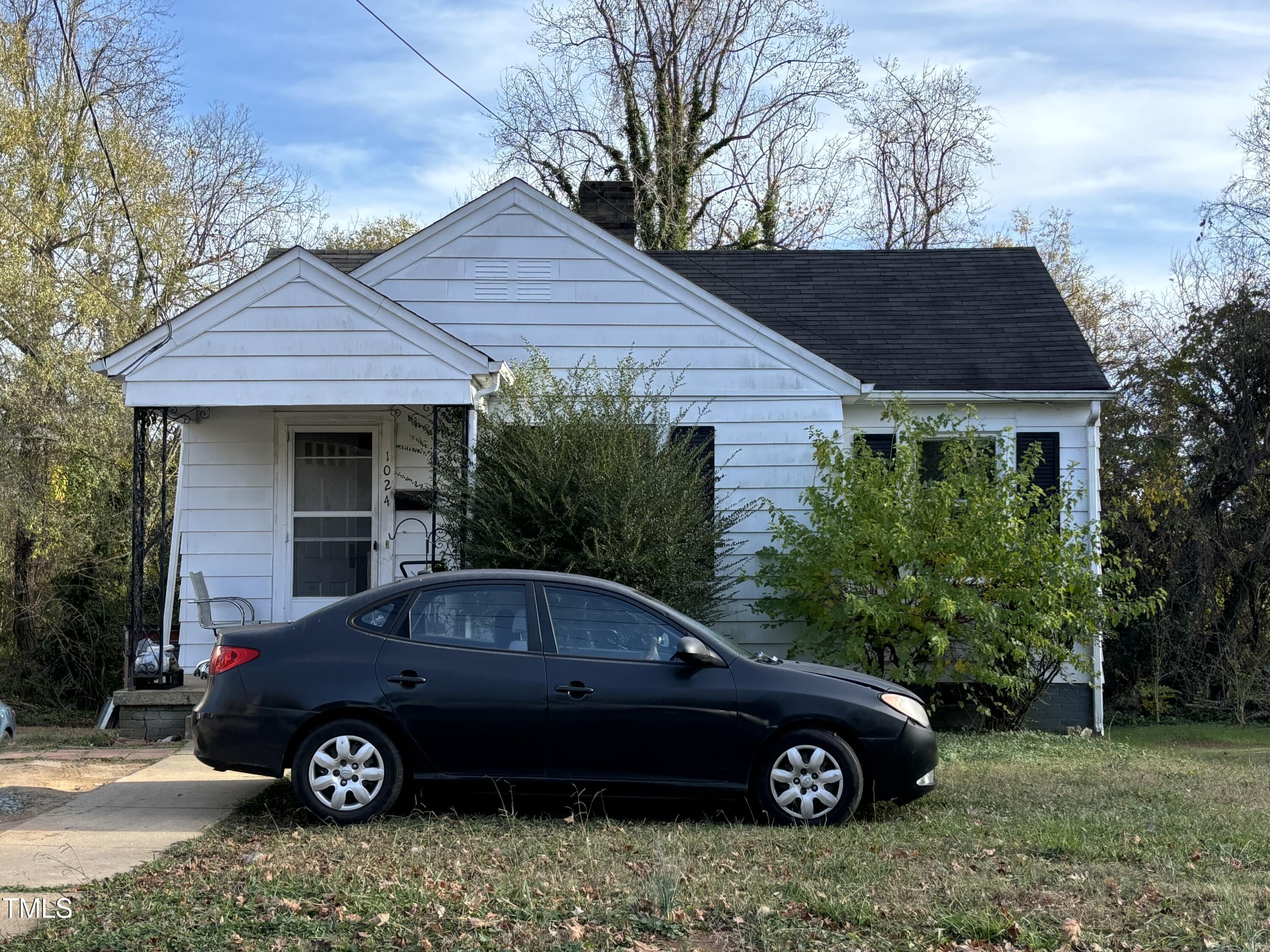 a car parked in front of a house