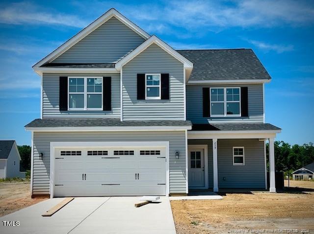 a front view of a house with a garage