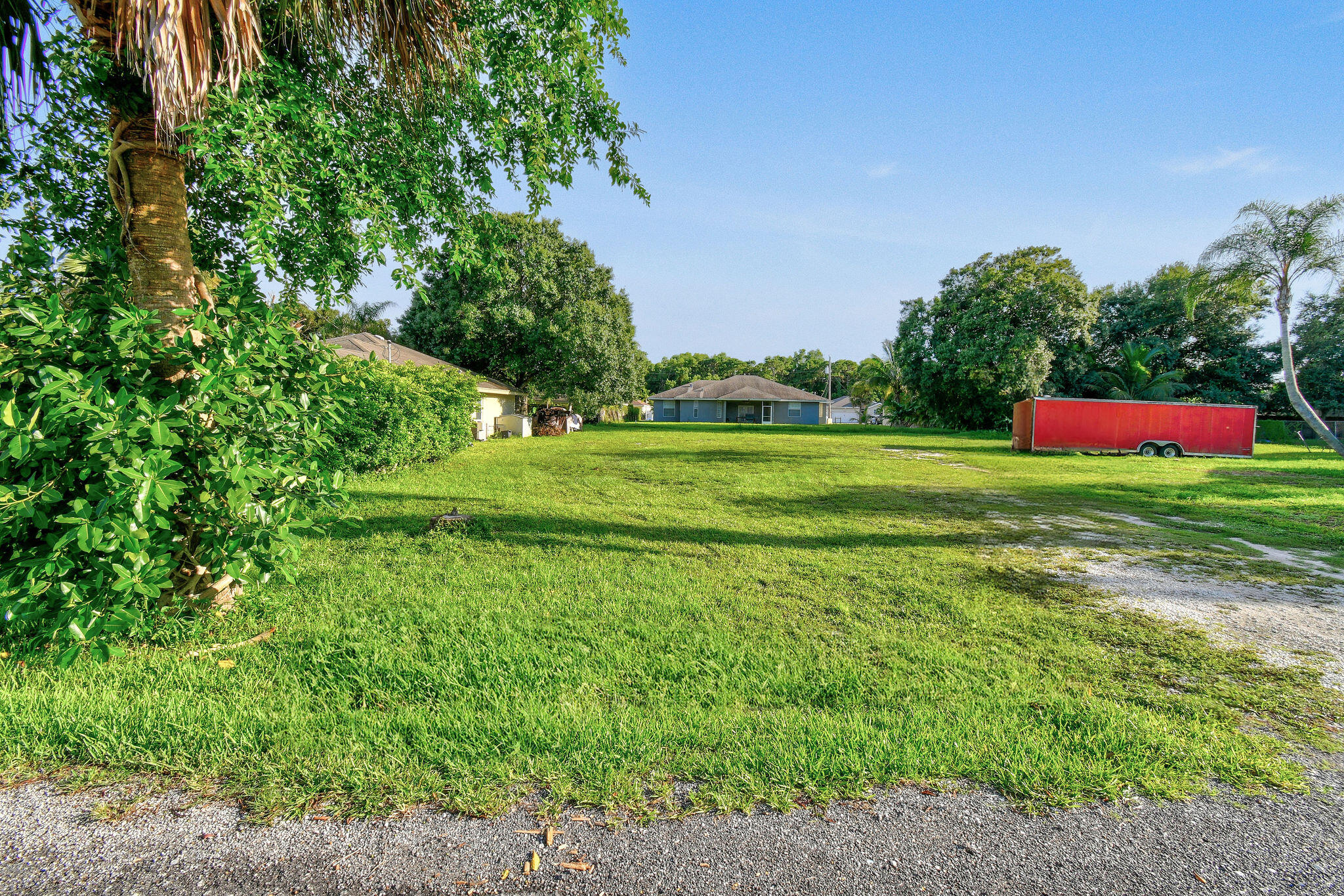 a view of a golf course with a big yard