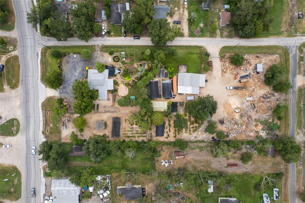 an aerial view of a house with a yard