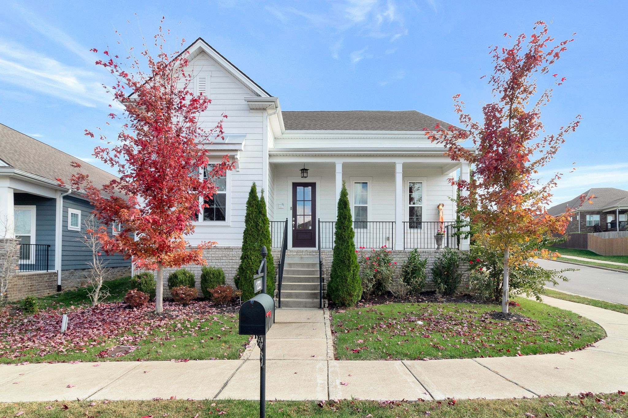 a front view of a house with garden