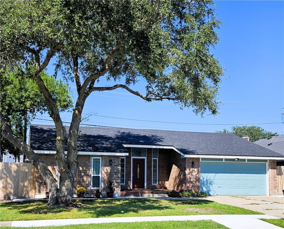 a front view of a house with garage