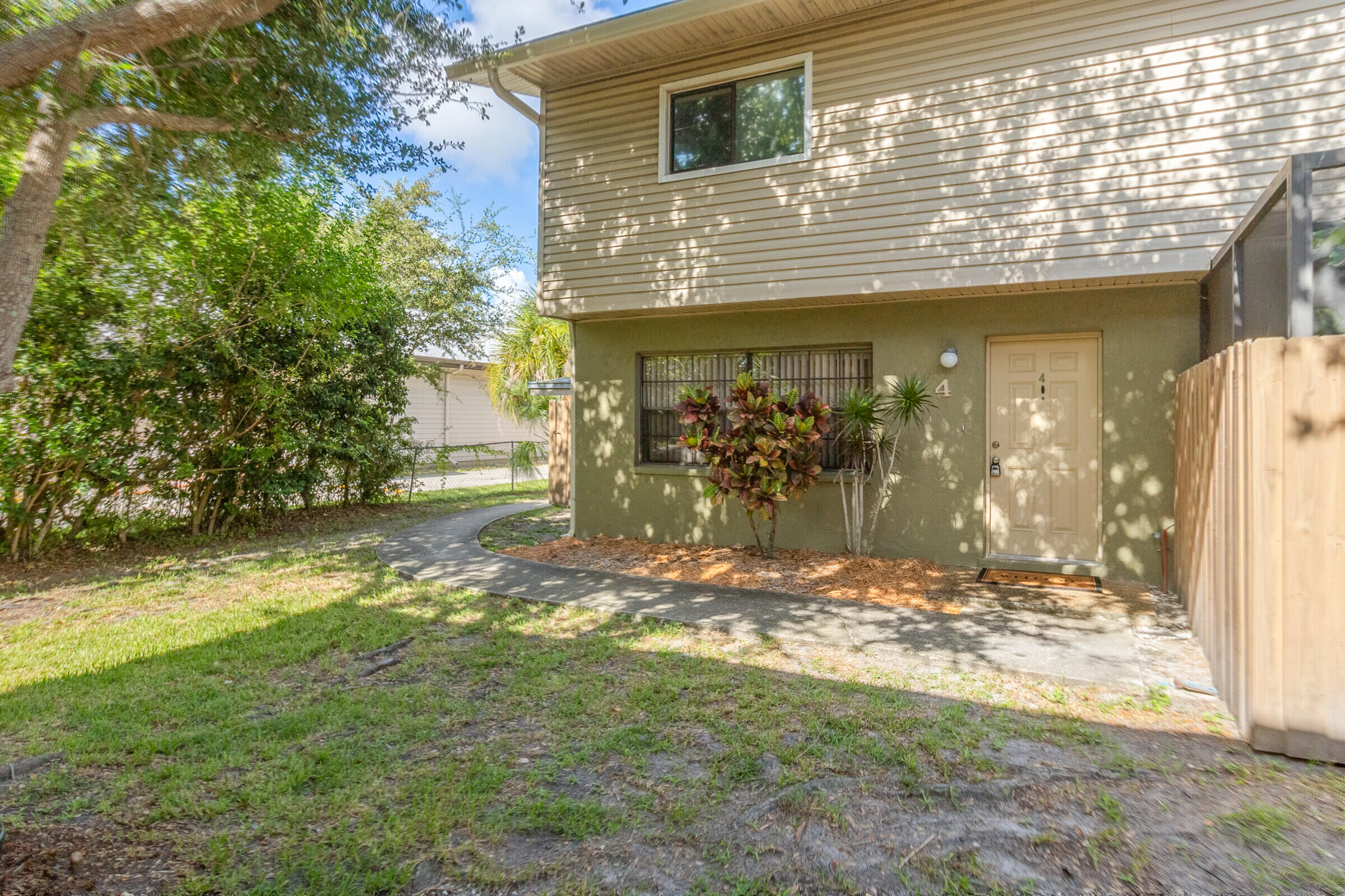 a view of a house with a yard and garage