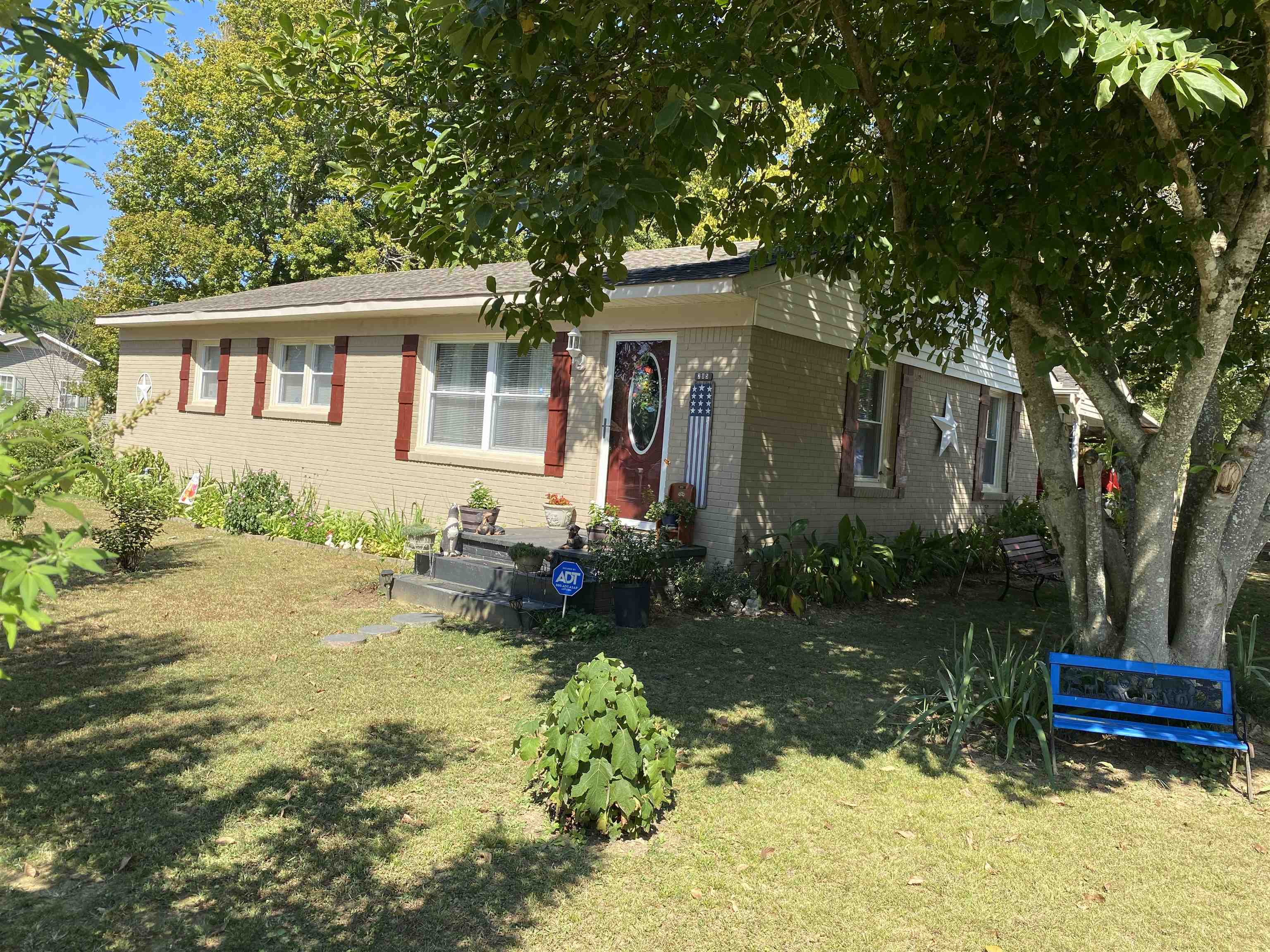 a front view of a house with garden