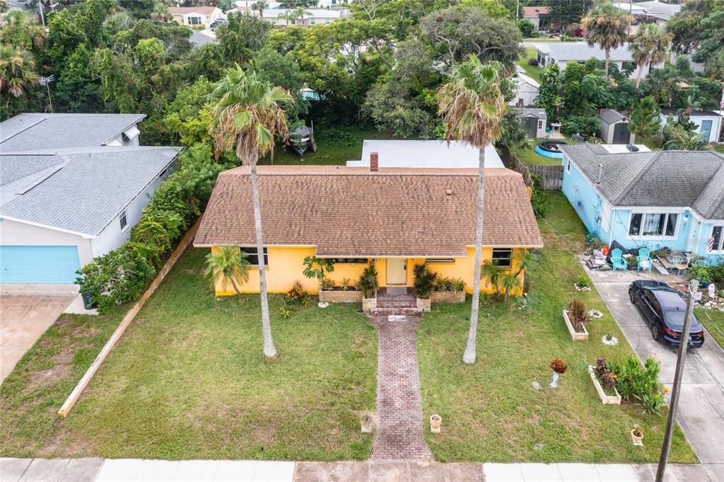 an aerial view of a house having patio yard