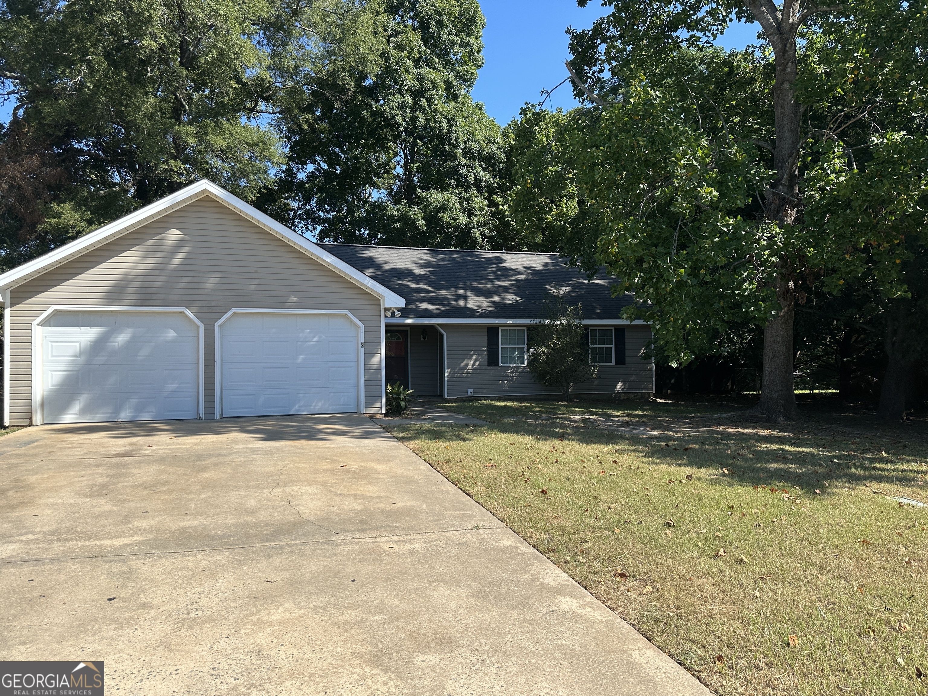 a house with trees in the background