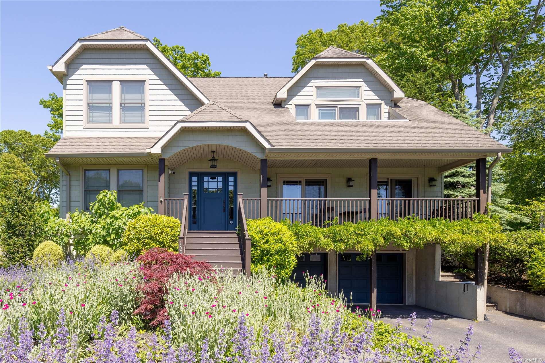 front view of a house with potted plants