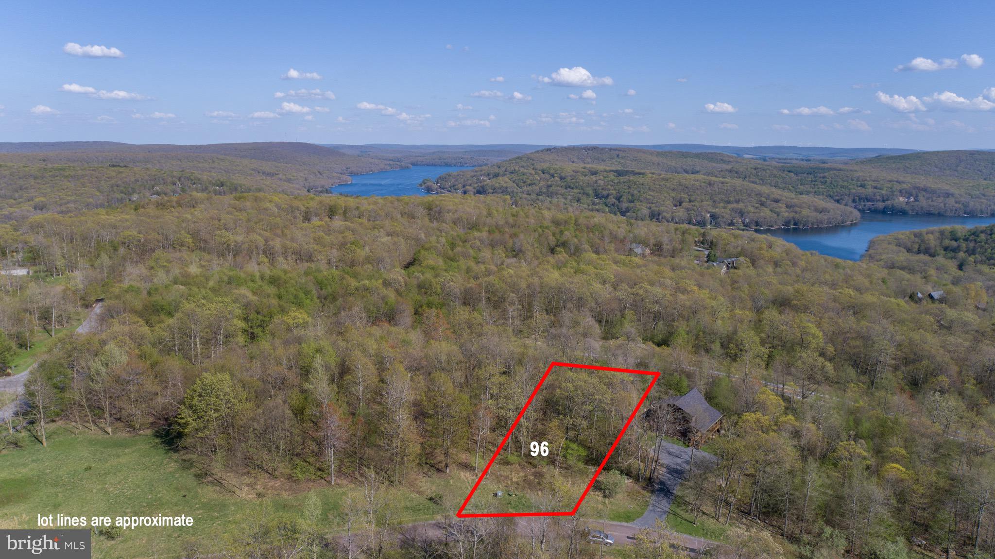 an aerial view of a houses with a yard