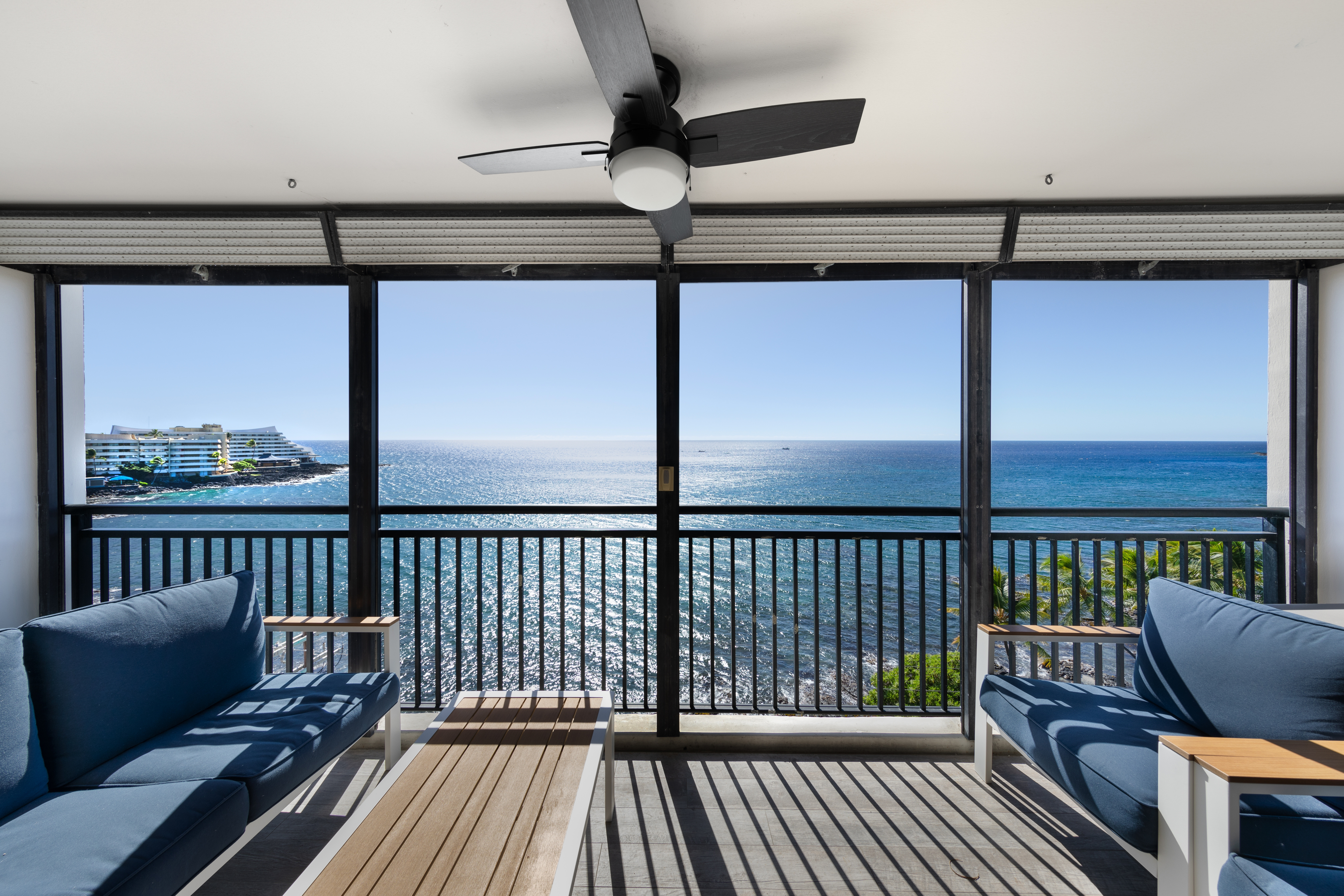 a view of a balcony with furniture