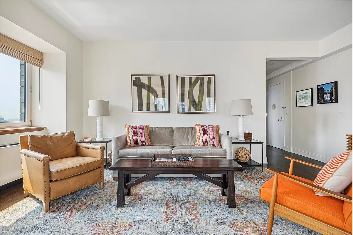 a living room with furniture and a window