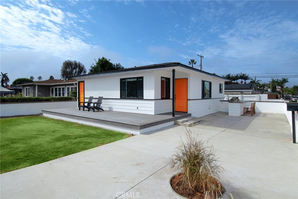 a swimming pool with outdoor seating and yard