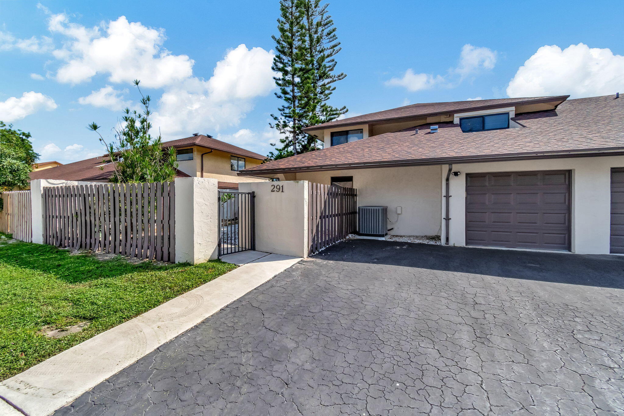 a view of a house with a yard and garage