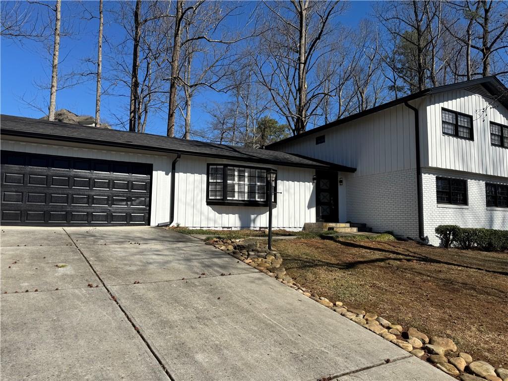 a front view of a house with a garage