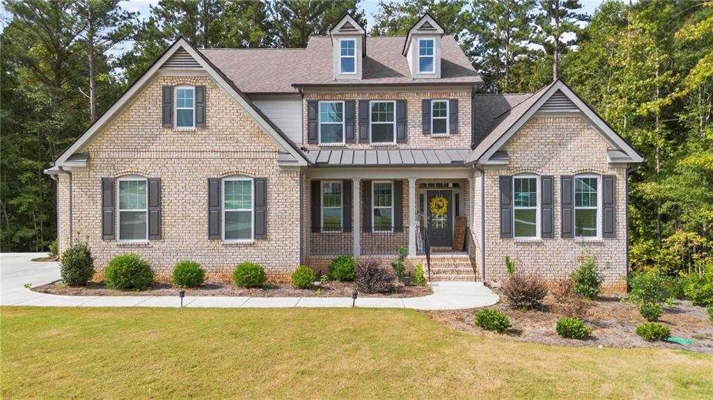 front view of a house with a yard