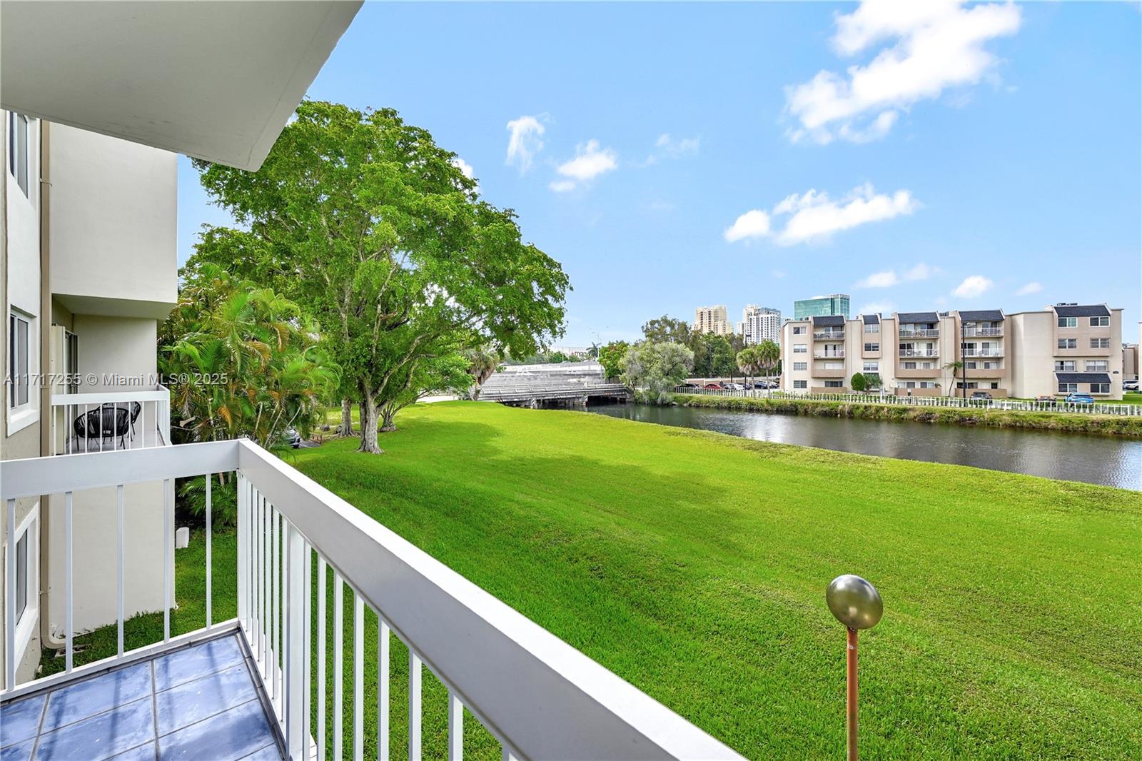 a balcony with view of lake and houses