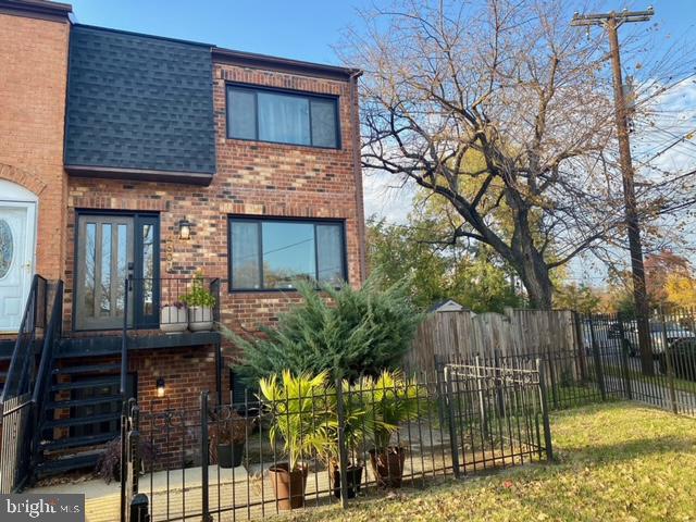 front view of a house with a garden