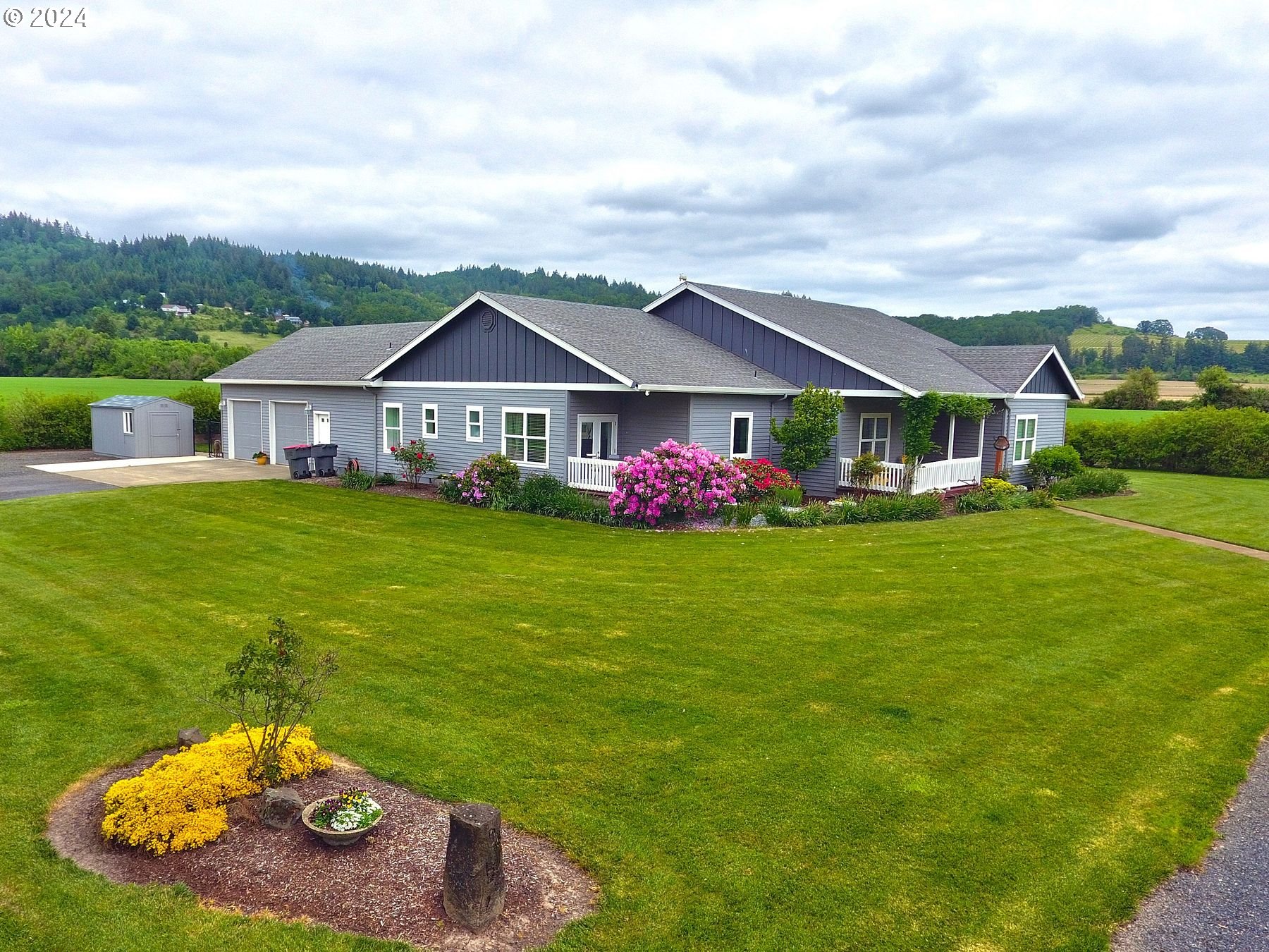 a front view of a house with garden