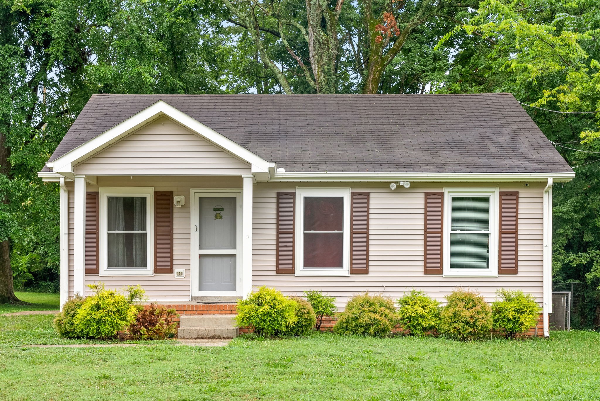 front view of a house with a yard