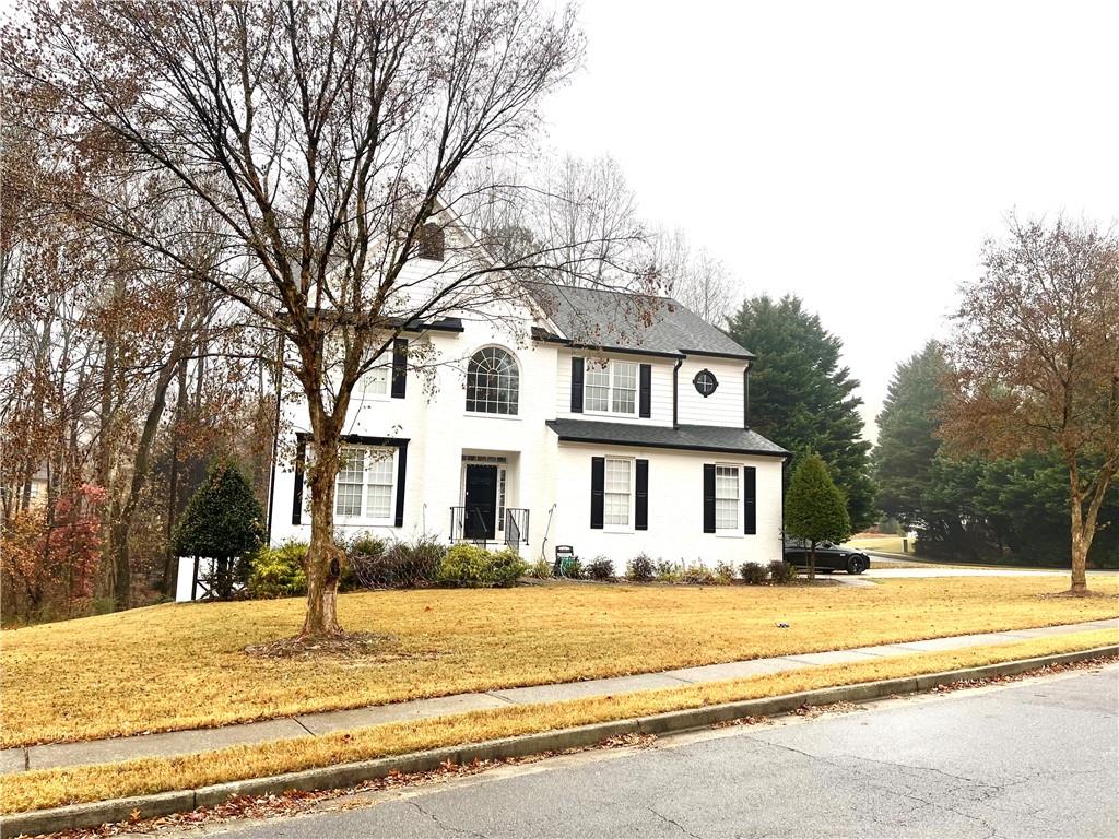 a front view of a house with a yard