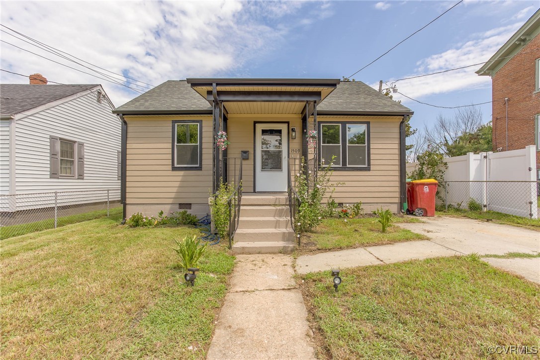 Bungalow-style house featuring a front lawn