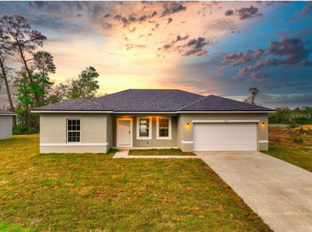 a front view of a house with yard