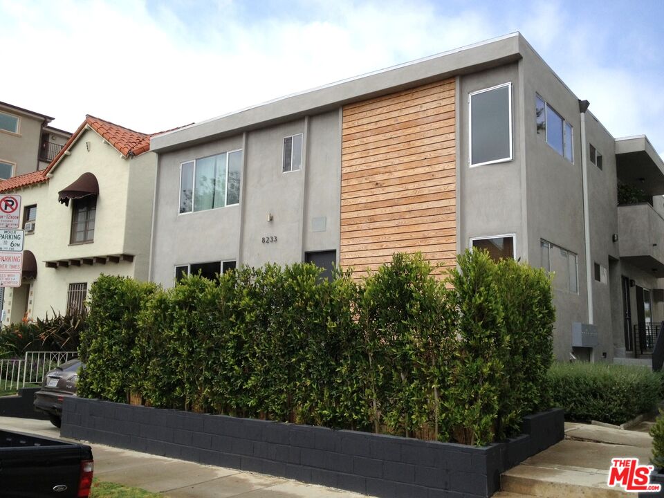 a house view with a garden space